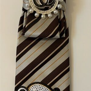 Chic Striped Tie with Brooch Accent